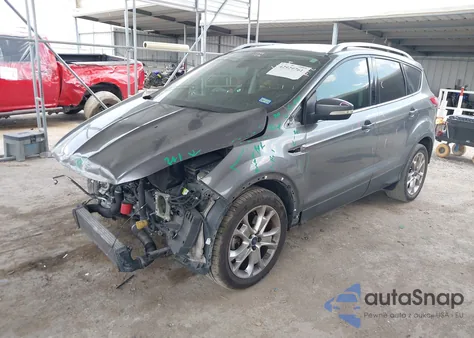 2014 Ford Escape Titanium z USA, uszkodzony, nr VIN 1FMCU0J9XEUE11657